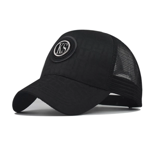 Black mesh trucker hat featuring a textured front panel and a round silver KS metal logo