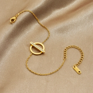 Elegant gold-plated stainless steel bracelet with a crystal geometric circle on champagne silk