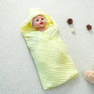 Detail of soft 6-layer cotton muslin baby hooded towel with breathable crepe texture