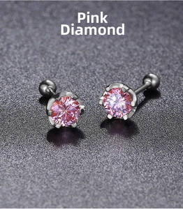 Detail view of pink round-cut cubic zirconia stud earrings with a six-prong silver setting