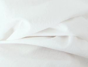 Vue détaillée de la texture du tissu en coton et lin blanc avec motif de tissage