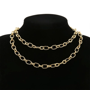 7mm gold stainless steel twisted curb chain necklace displayed on a black velvet mannequin