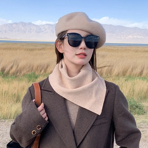 Outdoor winter beige knit scarf and beret set worn by a model in a natural scenic landscape