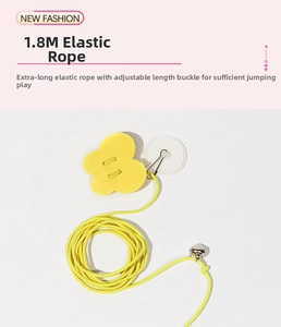 Detail of 1.8m elastic string with suction cup, yellow buckle and bell for cat toy