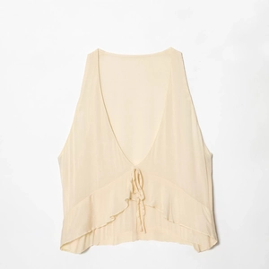 Chic apricot V-neck tie-front midi dress featuring a sleeveless minimalist design