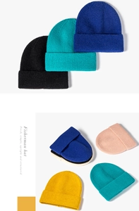 Detail of ribbed knit fisherman beanies showing textured weave in various solid colors