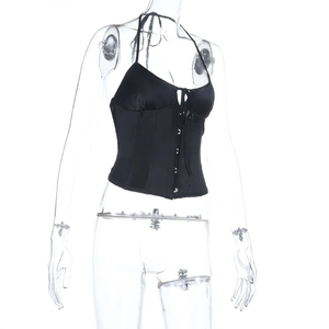 Close-up of black satin halter top featuring front lace-up detail and button accents