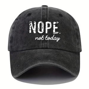 Macro detail of 'NOPE. not today' print on washed black vintage cotton baseball cap