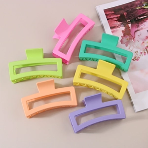 Detailed top view of 13cm oversized matte rectangular claw clips in six macaron colors