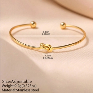 Adjustable 18K gold plated stainless steel knot cuff bracelet with ball ends
