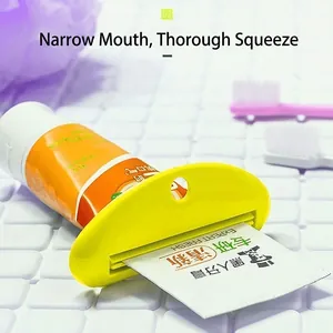 Manual yellow toothpaste squeezer for household tubes shown at a 45-degree angle