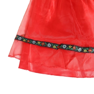 Detail of red satin skirt featuring floral embroidery lace for Oktoberfest costume