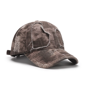 Distressed washed denim baseball cap with vintage ripped holes and adjustable strap