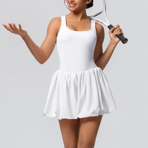 Close-up of white athletic tennis dress with pleated bubble hem and sleeveless design
