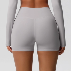Macro detail of high-waist yoga shorts featuring V-shape back seams and lifted butt contour