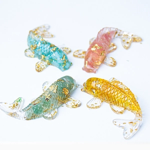 Set of four crystal koi fish statues with gold foil inside for office desk decor
