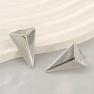 Polished silver stainless steel triangle earrings shown on a white minimalist background