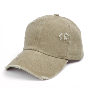Vintage washed khaki baseball cap with distressed rip details and a ponytail hole design