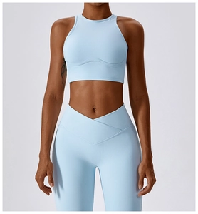 Detail of high-waist V-cross leggings and ribbed crop top in light blue sports set