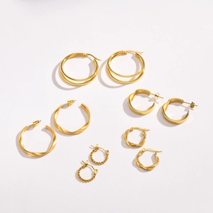 Golden stainless steel hoop earring set with twisted and polished designs for women