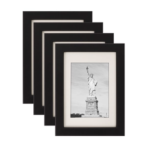 Set of four minimalist black wooden photo frames with white mats and artwork