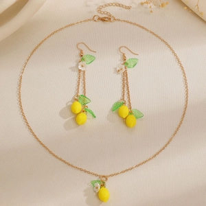 Fresh lemon jewelry set with yellow fruit pendants, green leaves and white flower motifs