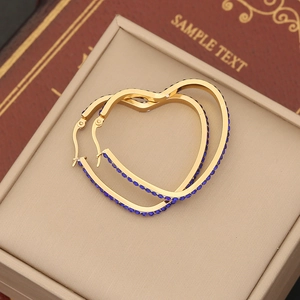 Chic gold-toned heart hoop earrings encrusted with sparkling dark blue rhinestones