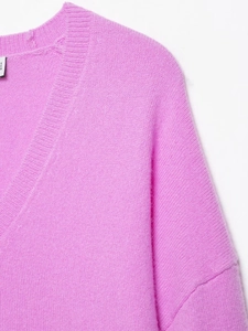 Detailed close-up of the ribbed V-neckline and soft knit texture of this pink sweater