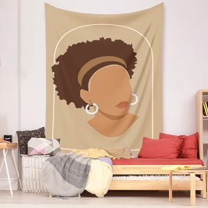 Detail of Bohemian tapestry featuring an abstract African woman portrait over a bed