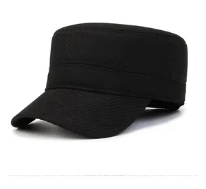 Detail of black winter military cap with metal F shield logo and twill texture fabric
