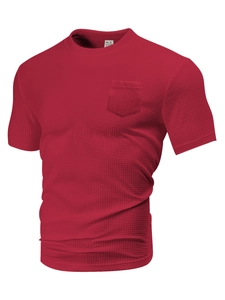 Detailed view of red waffle knit texture on a men's t-shirt with chest pocket and crew neck