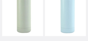 Detail of matte frosted stainless steel water bottles in light green and blue finishes