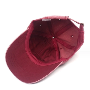 Unisex burgundy washed cotton baseball cap with vintage distressed texture and adjustable strap