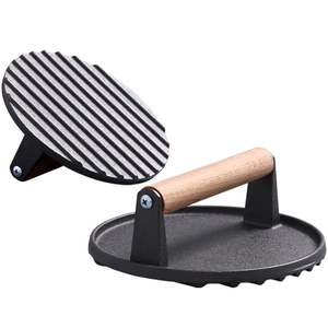 Presse à viande ronde en fonte avec manche en bois et fond rainuré pour griller