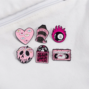 Pink heart skull enamel pin set featuring gothic spooky badges for Halloween accessories