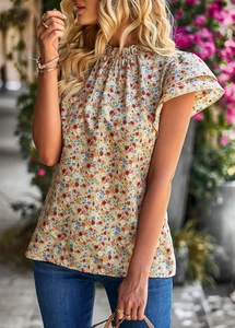 Detail of floral print blouse with ruffled double-layered sleeves and stand collar