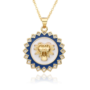 Gold lion head necklace with blue enamel and sparkling crystals in a vintage design