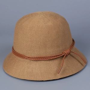 Detailed close-up of a khaki knitted bucket hat with a decorative brown woven cord tie