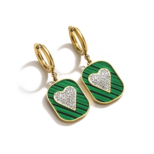 Detail of gold titanium earrings featuring green striped pendants with heart-shaped crystal