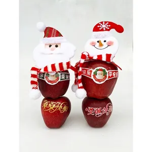 DIY Christmas plush snowman and Santa hat decoration with mini scarf on red apples