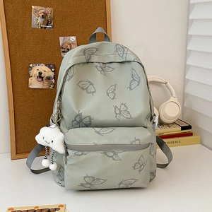 Fashion butterfly print student backpack in sage green with a plush cloud pendant