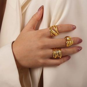 Three-piece set of minimalist gold-plated copper rings with irregular open designs