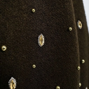 Brown knit cardigan with half sleeves, golden beads, and rhinestone embellishments