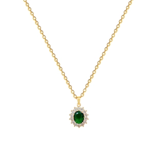Elegant gold oval emerald necklace with white diamond accents on a white background