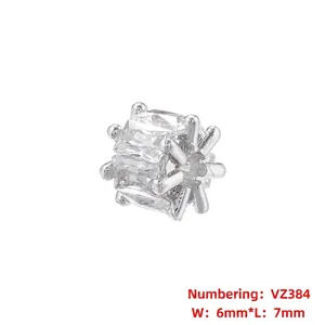 Macro view of VZ384 silver gear spacer bead with rectangular zircons measuring 6x7mm