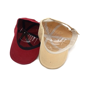 Interior view of embroidered cotton baseball caps with reinforced stitching and sweatband