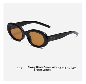 Detail of vintage oval black frame sunglasses with tea tinted lenses and size 51-15-142