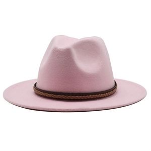 Detail of pink wool fedora hat with a classic brown braided faux leather band decoration