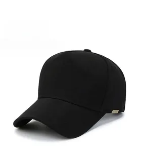 Detail of cotton twill five-panel black baseball cap with metallic SPORT emblem on the side