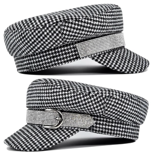 Detail view of houndstooth newsboy hat featuring rhinestone band and silver metal buckle